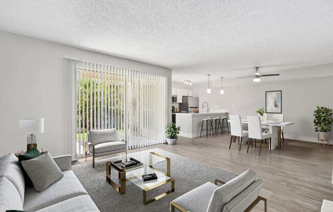 our apartments offer a living room with a couch a coffee table and a dining table