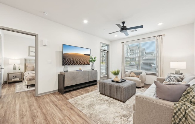 a living room with a couch and a tv