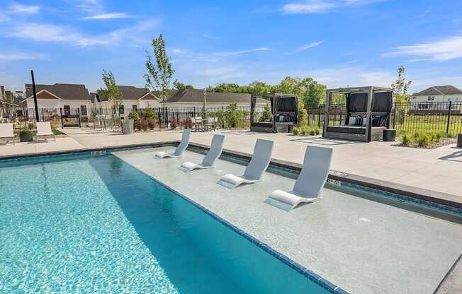 Slate at Fishers District Modern Villas and Townhomes in Fishers, Indiana Pool with Lounge Chairs