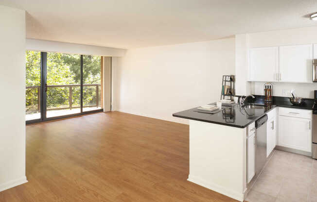 Living Room and Kitchen with Hard Surface Flooring and Private Balcony