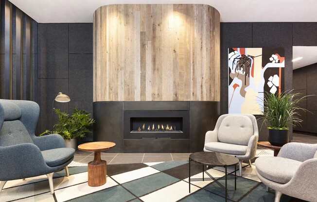 A modern living room with a fireplace and comfortable seating.