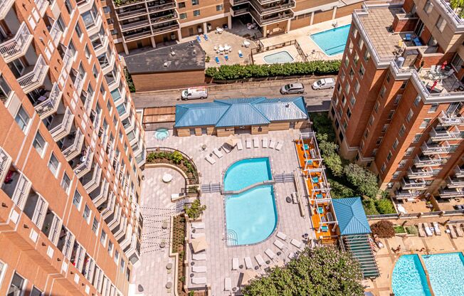 an aerial view of a swimming pool in an apartment building