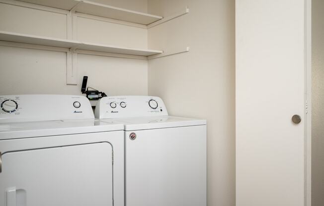 a laundry room with a washer and dryer