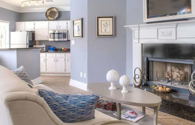 A living room with a fireplace and a couch.