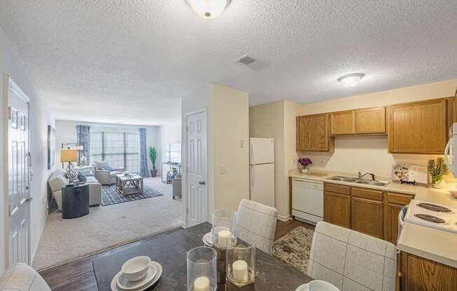 a kitchen and living room with a dining room and a living room