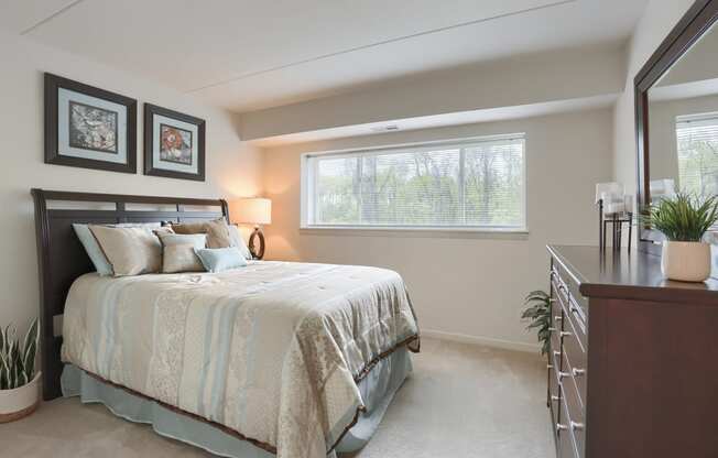 Harrisburg Apartments | Bedroom Apartment at Twin Lakes | a bedroom with a bed and a dresser