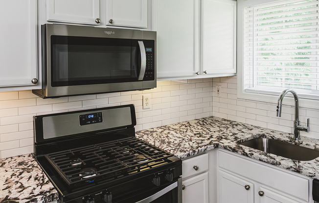 Stainless steel appliances, beautiful granite counters, and upgraded fixtures in our newly reimagined homes