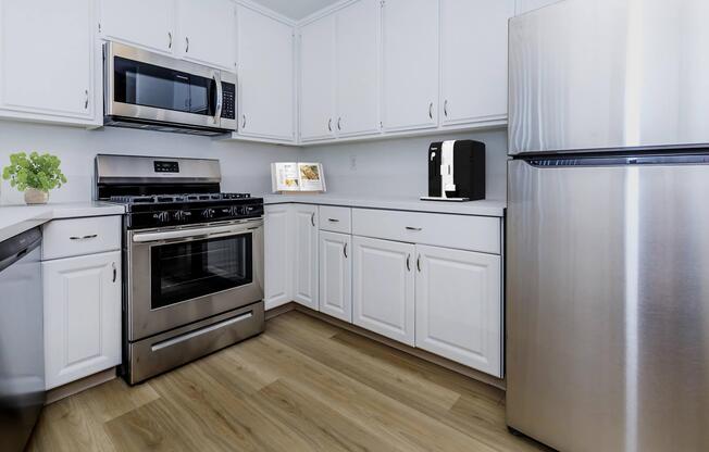 a stove top oven sitting inside of a kitchen