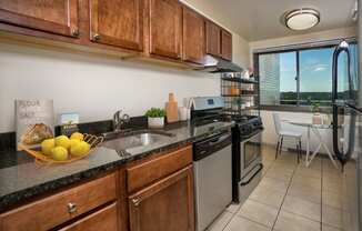 wood cabinets and granite countertops at Colesville Towers Apartments, Silver Spring, MD, 20910
