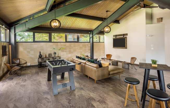 a game room with a foosball table and a couch at COVE West Hartford, West Hartford, 06119