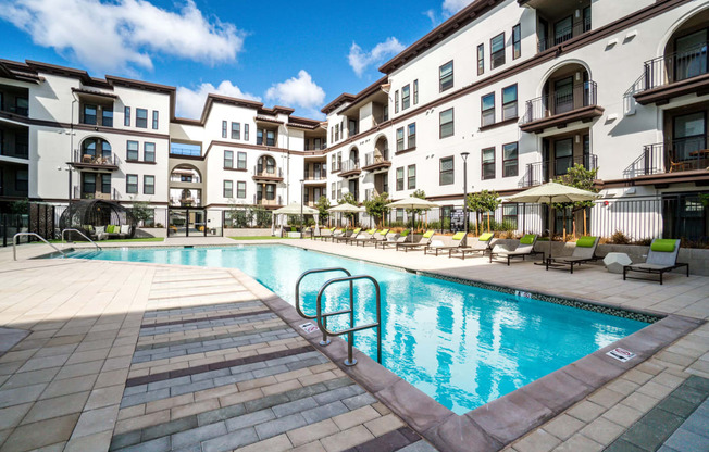 Apartments for Rent in Santa Clara CA - Sparkling Swimming Pool Surrounded by Lounge Chairs