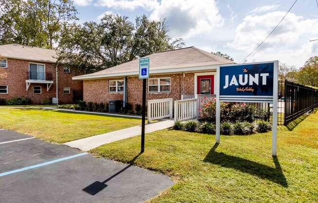 The Jaunt Apartments in Charleston South Carolina photo of exterior of leasing office with The Jaunt signage in front.