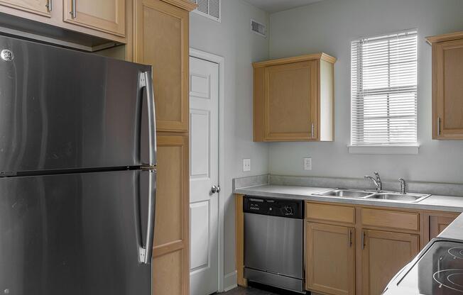 a kitchen with a stove top oven sitting inside of a refrigerator