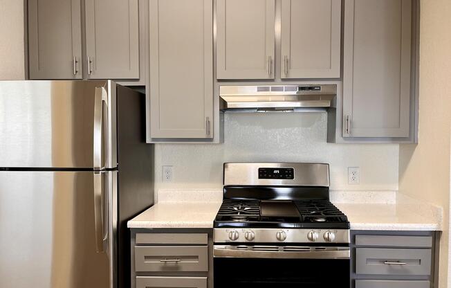 a kitchen with a stove top oven sitting inside of a refrigerator