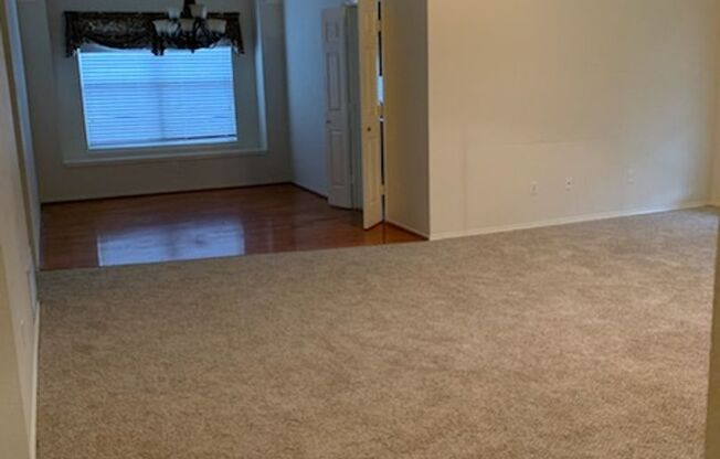 Beautifully maintained custom home on a clean and neat tree lined street