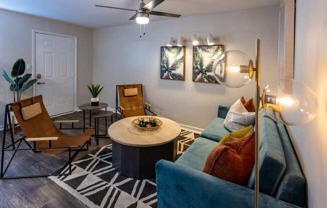 a living room with a blue couch and a coffee table