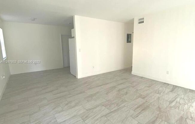 Updated 3-Bed/2-baths Home with Screened Porch & Lush Yard in Pompano Beach Highlands