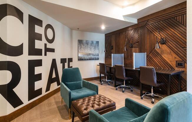 a conference room with a table and chairs and a wall with a sign