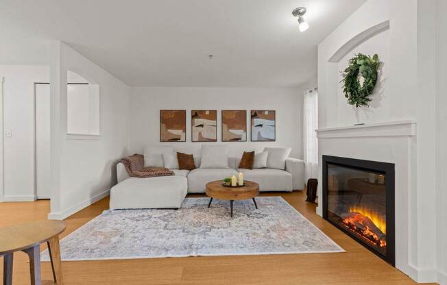 A living room with a fireplace and a couch.