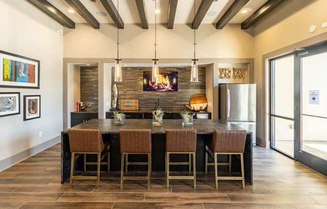 a kitchen with a large center island with a wooden countertop