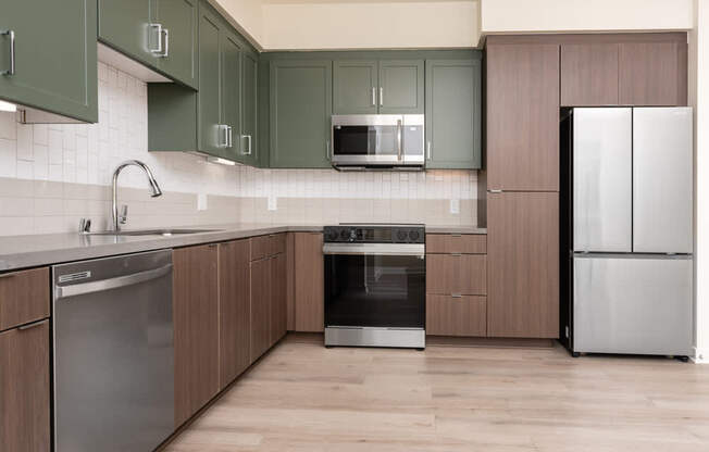 A kitchen with wooden cabinets and stainless steel appliances.