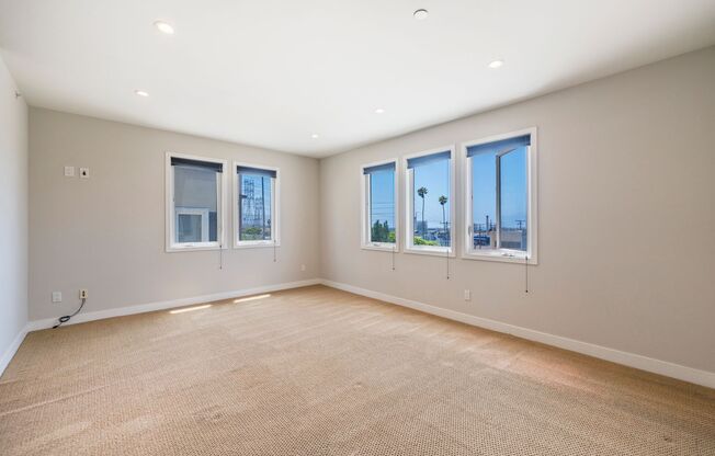 LUXURIOUS-CONTEMPORARY TOWNHOUSE W/ AMAZING PANORAMIC OCEAN VIEWS, HIGH-END AMENITIES & 2-CAR GARAGE CLOSE TO SHOPPING & 6 BLOCKS TO BEACH. ZONED FOR TOP SCHOOL DISTRICT (Pre K – 12)