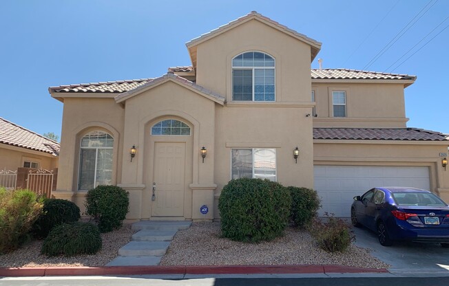 Two story home in gated community with community pool, featuring 4 bedrooms including one bedroom downstairs with a private bathroom! Home has a large great room with high ceilings that's visible from the second floor! Open kitchen with granite countertop
