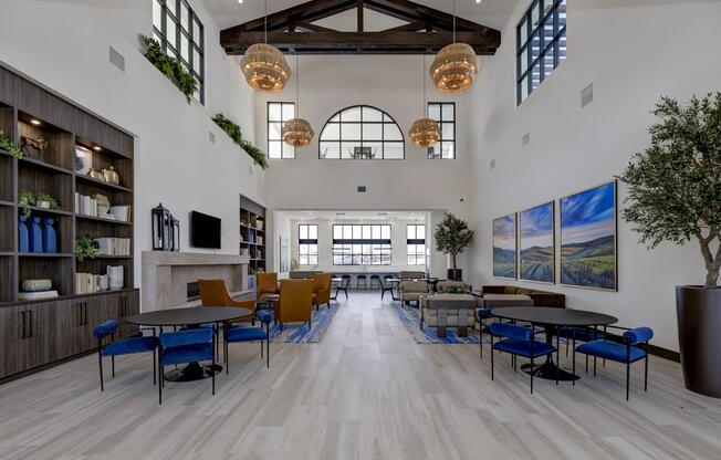 a living room filled with furniture and a wood floor