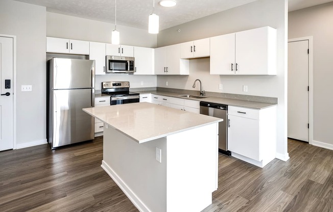 Studio, one two and three bedroom apartments and townhomes featuring open concept floor plans, dens, large windows, stainless steel appliances, quartz countertops, eat-in kitchens, pantries, LVT flooring and much more at The Trails at North Streams in Omaha, NE