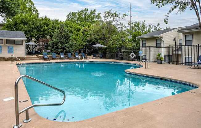 A small pool with a ladder in the middle of it.