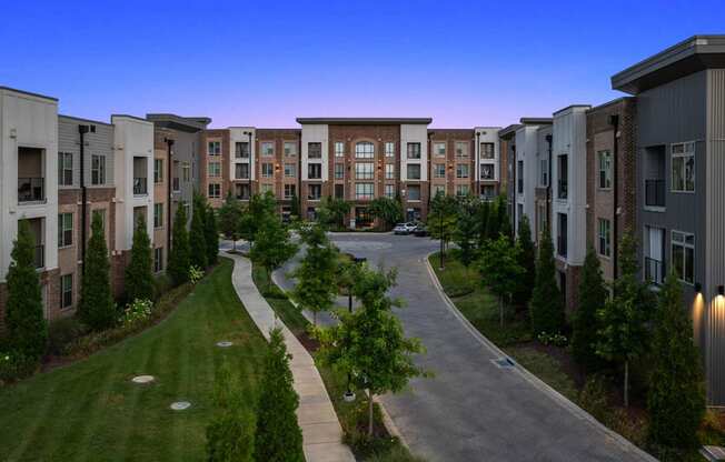 an aerial view of an apartment complex at dusk