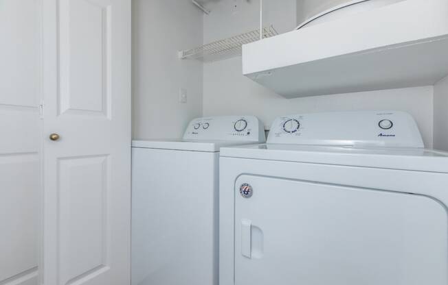 a laundry room with a washer and dryer