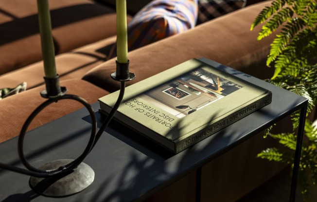 a book sitting on top of a table with candles