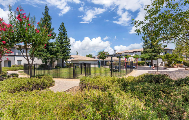 The gated dog park is conveniently located right next to the playground, allowing both kids and pets to enjoy fun and playtime close by at Ascent at the Galleria.