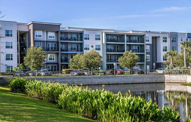 an apartment building overlooking a body of water