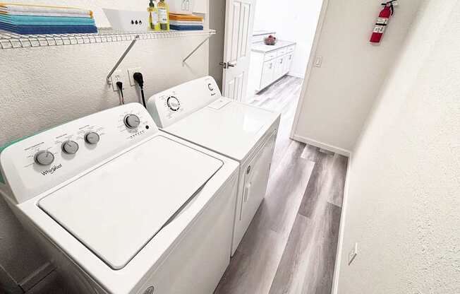 A white washing machine with a green label on the front.