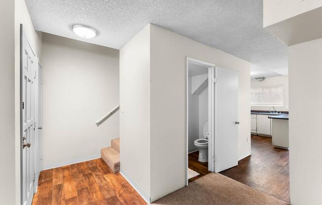 a kitchen with a sink and a refrigerator