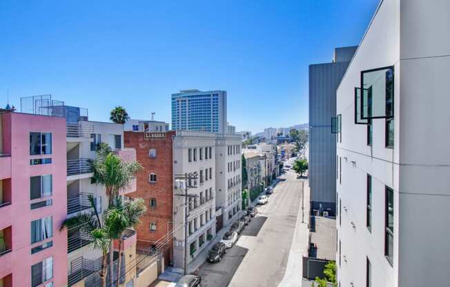 a view of a city street from a high rise building
