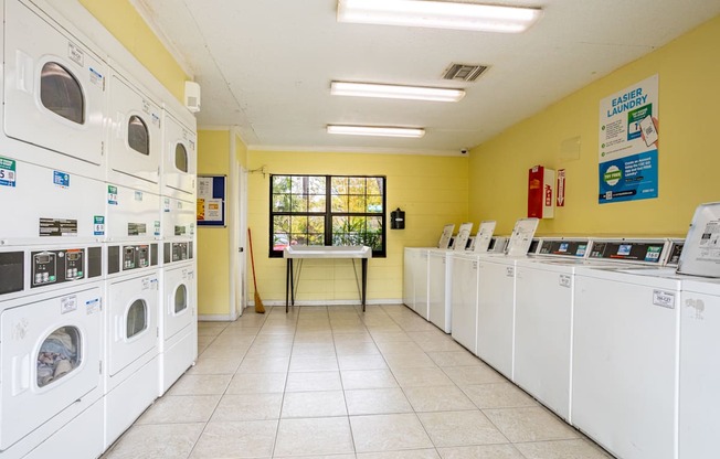 A laundromat with rows of washers and dryers.