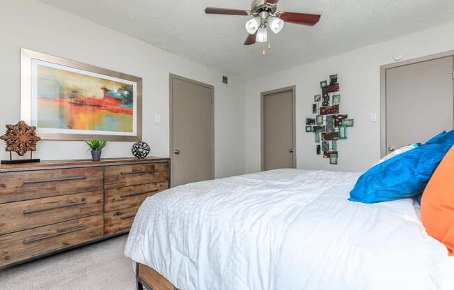 furnished bedroom with a wooden dresser