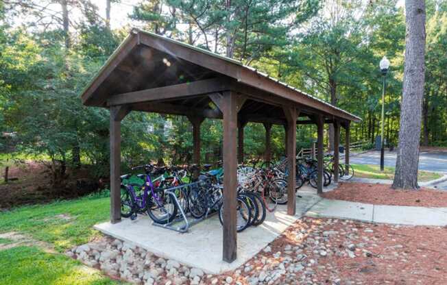 A wooden pavilion with bicycles parked in front.at Crestline Cary, Cary, NC