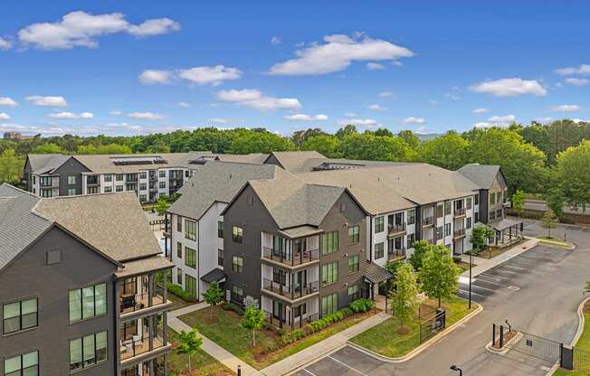 an aerial view of an apartment building on a city street