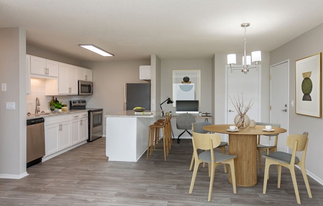 Kitchen connected to living room with circular dining table