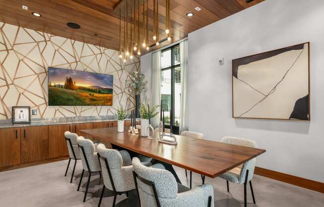 a dining room with a wooden table and chairs at The Colony, Charlotte, 28211