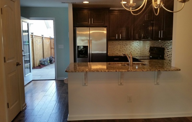 Townhome in Villages of Riverwood, Upgrades include Granite, Hdwd Floors, 1 Car Garage, Community Pool and Fitness
