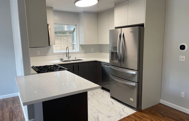 Updated Two Story Townhome w/ Two Car Garage