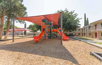 a playground at the whispering winds apartments in pearland, tx