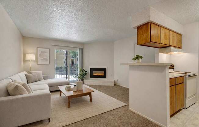 A living room with a fireplace and a couch.