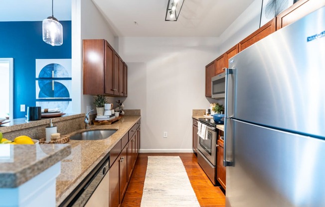 a kitchen with wood cabinets and granite countertops