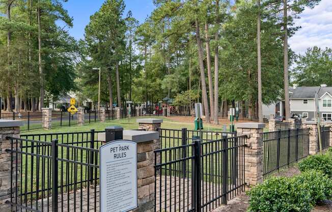 a cemetery with a fence and a sign in front of it at Trails at Short Pump Apartments, Richmond, VA, 23233